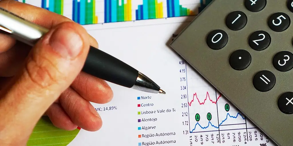 Financial Analysis for Landlords in DFW: Spotting Trouble Before It’s Too Late Analyzing financial charts and graphs with a calculator, highlighting tips for landlords in DFW to spot financial trouble earl